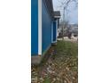 Blue house exterior with white trim and landscaping at 509 Atlantic Ave, Rocky Mount, NC 27801