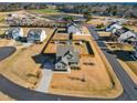 Expansive aerial view of a charming home with a fenced backyard in a peaceful neighborhood at 8217 Cannon Grove Dr, Willow Springs, NC 27592