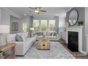 Spacious living room with comfortable seating and a cozy fireplace at 1051 Cross Rail Ln, Raleigh, NC 27603