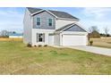 Two-story house with gray siding, white trim, and a two-car garage at 41 Alderman Ct, Dunn, NC 28334