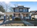 Two-story Craftsman home with gray siding, white trim, and a front porch at 835 Sunset Ave, Rocky Mount, NC 27804