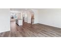 Open-concept living space boasts hardwood floors, a spacious layout, and ample natural light for comfortable living at 867 Parc Townes Dr # 3, Wendell, NC 27591