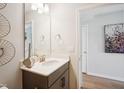 Clean bathroom with vanity, mirror, and contemporary decor at 871 Parc Townes Dr # 1, Wendell, NC 27591