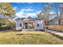 Recently updated cottage, featuring a welcoming front porch and landscape at 1004 N Fayetteville Ave, Dunn, NC 28334