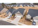 Aerial view of a new neighborhood showcasing modern homes and well-maintained landscaping at 1008 Ashton Oak Ct, Durham, NC 27703