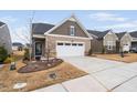 Well-maintained single-Gathering home with a two-car garage and a beautifully landscaped yard at 1008 Ashton Oak Ct, Durham, NC 27703