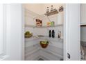 Well-organized pantry with wire shelving, perfect for storage at 1741 Old Fields Blvd, Haw River, NC 27258