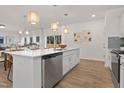 Spacious kitchen featuring a large island, pendant lights, and an open-concept design at 216 Horseshoe Pl # 25, Angier, NC 27501