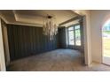 Dining room with wainscotting, decorative chandelier, and lots of natural light at 286 W Beech Slope Ct, Chapel Hill, NC 27517