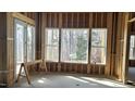 Bright, spacious interior under construction, featuring large windows and hardwood floors at 286 W Beech Slope Ct, Chapel Hill, NC 27517