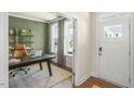 Bright home office features a large desk, built-in shelving, and an accent wall at 313 Umstead St, Sanford, NC 27330