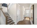 Elegant staircase with dark wood steps and white railings at 313 Umstead St, Sanford, NC 27330
