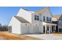 Two-story white farmhouse with two-car garage and screened porch at 35 Mable Court # 3, Lillington, NC 27546