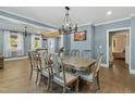 Bright dining room featuring a large table and chandelier at 507 Hawkins Ave, Sanford, NC 27330