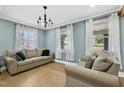 Cozy living room with hardwood floors, two sofas, and natural light at 507 Hawkins Ave, Sanford, NC 27330
