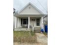Small house with covered porch, needing some landscaping at 1103 E Lane St, Raleigh, NC 27601