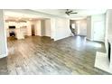 Spacious open concept with modern flooring, fireplace, and ample natural light flowing into the kitchen at 203 Lake Edge Dr, Lillington, NC 27546