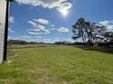 Spacious backyard with grassy area and some trees at 59 Holly Grove Ln, Lillington, NC 27546