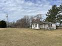 White ranch home on a grassy lot at 852 Old Stage S Rd, Erwin, NC 28339
