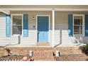 Inviting front entrance with a blue door and brick steps at 105 N Bend Dr, Knightdale, NC 27545