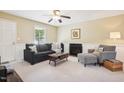Cozy living room featuring a comfortable sofa and a fireplace at 105 N Bend Dr, Knightdale, NC 27545