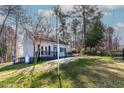 Cute cottage with a welcoming front porch and large yard at 164 Pinto Dr, Louisburg, NC 27549