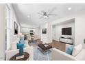 Bright open-concept living room featuring modern furnishings and hardwood floors at 2612 Ashe St, Durham, NC 27703