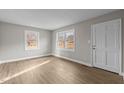 Spacious living area featuring hardwood floors and large windows at 302 Ellen Dr, Knightdale, NC 27545