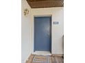 Inviting condo entryway with a blue door and welcome mat at 5112 Flint Ridge Pl, Raleigh, NC 27609