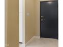 Interior hallway with a dark door and light walls at 5112 Flint Ridge Pl, Raleigh, NC 27609