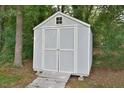 Grey shed with white trim and wooden walkway at 5617 Laurel Crest Dr, Durham, NC 27712