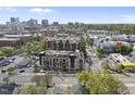 An aerial shot showcases the urban condominium community, highlighting its location within the cityscape at 615 W Peace St # 307, Raleigh, NC 27605
