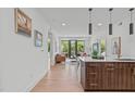 Bright living area featuring modern finishes and a seamless flow to the balcony at 615 W Peace St # 307, Raleigh, NC 27605