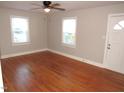 Hardwood floors and neutral walls in this bright living room at 734 Baker St, Oxford, NC 27565