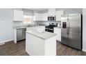 Modern kitchen with stainless steel appliances and an island at 816 Bright Nova Way, Wendell, NC 27591