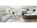 Bright kitchen and dining area with a modern island and stainless steel appliances at 942 Allen Park Dr, Knightdale, NC 27604