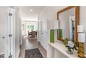 Bright and spacious foyer with hardwood floors and views into the dining area at 110 Ethel Ln, Angier, NC 27501