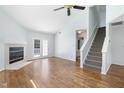 Spacious living room with hardwood floors, fireplace, and access to deck at 129 Weatherhill Pt, Carrboro, NC 27510