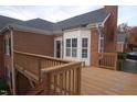 Wooden deck overlooking landscaped backyard at 2004 Clyde Bank Ct, Cary, NC 27511