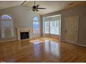 Bright living room with hardwood floors and fireplace at 2004 Clyde Bank Ct, Cary, NC 27511