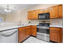 Modern kitchen with stainless steel appliances at 2621 Oldgate Dr # 105, Raleigh, NC 27604