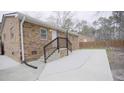 Brick house with a patio, steps, and backyard at 915 Da Vinci St, Durham, NC 27704