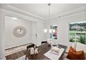 Bright dining room with a table set for two and a view of the backyard at 0 Hanover Dr, Sanford, NC 27330