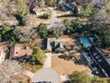 Aerial view showing home's location and a community pool at 113 Meadowglades Ln, Cary, NC 27518