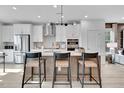 Modern kitchen with island and stainless steel appliances at 1204 Alston Landing Way # 07, Cary, NC 27519