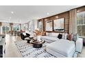 Open living room with sectional sofa and large windows at 1204 Alston Landing Way # 07, Cary, NC 27519