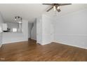 View of an open concept living room with hardwood floors and neutral paint at 3 Cheltenham Dr, Clayton, NC 27520
