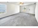 Spacious living room with gray carpeting and neutral walls at 3113 Skybrook Ln, Durham, NC 27703