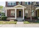 Townhome's front entrance with a covered porch at 332 Dove Cottage Ln, Cary, NC 27519