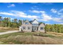 Lovely home with brick and siding accents, shutters, impeccable lawn and professional landscaping at 3803 Bennett Grove Dr, Wake Forest, NC 27587